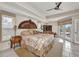 This main bedroom offers tile flooring, natural light, and ceiling fan at 17188 Cape Horn Blvd, Punta Gorda, FL 33955