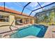 Outdoor living showcasing pool, brick patio, and screened-in lanai for relaxation and entertaining at 17188 Cape Horn Blvd, Punta Gorda, FL 33955