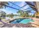 Inviting screened-in pool area, surrounded by brick pavers and overlooking a tranquil lake at 17188 Cape Horn Blvd, Punta Gorda, FL 33955