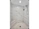 A bright walk-in shower with white marble tile at 17188 Cape Horn Blvd, Punta Gorda, FL 33955