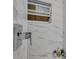Modern shower with marble tile, chrome fixtures, and a built-in niche at 17188 Cape Horn Blvd, Punta Gorda, FL 33955
