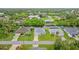 Aerial view of a neighborhood featuring single-Gathering homes with lush landscaping along a waterfront community at 17200 Gulfspray Cir, Port Charlotte, FL 33948