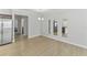 Spacious dining area features laminate flooring, modern light fixture and bright natural light at 17200 Gulfspray Cir, Port Charlotte, FL 33948