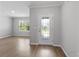 Bright foyer featuring modern wood floors, a decorative front door, and plenty of natural light at 17200 Gulfspray Cir, Port Charlotte, FL 33948