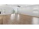 Spacious living room featuring light wood floors and a sliding glass door at 17200 Gulfspray Cir, Port Charlotte, FL 33948