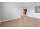 Bright, open-concept living room with light wood floors and neutral paint at 17200 Gulfspray Cir, Port Charlotte, FL 33948