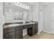 Main bathroom includes double sinks with dark cabinetry and a large mirror at 17200 Gulfspray Cir, Port Charlotte, FL 33948