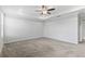 Spacious main bedroom with tray ceiling and ceiling fan at 17200 Gulfspray Cir, Port Charlotte, FL 33948
