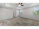 Bright main bedroom featuring neutral walls and carpet, with windows at 17200 Gulfspray Cir, Port Charlotte, FL 33948