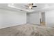 Spacious main bedroom with tray ceiling and views to ensuite bathroom at 17200 Gulfspray Cir, Port Charlotte, FL 33948