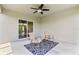 Relaxing patio space with a ceiling fan and outdoor seating, perfect for enjoying the fresh air and sunshine at 17200 Gulfspray Cir, Port Charlotte, FL 33948