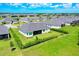 Aerial view of backyard and a neatly landscaped yard in a peaceful neighborhood setting at 17336 Sandpearl Rd, Venice, FL 34293