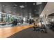 Spacious gym with modern fitness equipment and large windows offering natural light and outdoor views at 17336 Sandpearl Rd, Venice, FL 34293