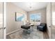 This office features a modern desk, chair, stylish light fixture and large window at 17336 Sandpearl Rd, Venice, FL 34293
