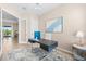 Bright office space featuring modern desk, chair, stylish light fixture and a view of the outdoors at 17336 Sandpearl Rd, Venice, FL 34293
