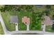 Aerial view of the single-Gathering home showing the layout of the property and surrounding neighborhood at 1983 Longstroth Ave, North Port, FL 34288