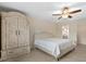 Comfortable bedroom featuring tiled flooring and an armoire, with a ceiling fan at 1983 Longstroth Ave, North Port, FL 34288