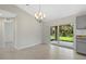 Light-filled dining area with sliding glass doors to the patio at 1983 Longstroth Ave, North Port, FL 34288