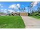 Inviting single-story home boasting a well-kept lawn and a convenient two-car garage at 1983 Longstroth Ave, North Port, FL 34288