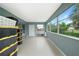 Bright Florida room with large windows offering views of the backyard at 21524 Edgewater Dr, Port Charlotte, FL 33952