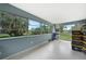Bright Florida room with large windows offering views of the backyard at 21524 Edgewater Dr, Port Charlotte, FL 33952