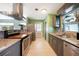 Well-equipped kitchen with granite countertops, stainless steel appliances, and tile backsplash at 21524 Edgewater Dr, Port Charlotte, FL 33952
