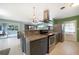 Modern kitchen with granite countertops, stainless steel appliances, and open design at 21524 Edgewater Dr, Port Charlotte, FL 33952