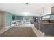 Open concept living room with tile flooring, dining area, and seamless flow to kitchen at 21524 Edgewater Dr, Port Charlotte, FL 33952