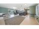 Spacious living room featuring open layout, natural light, and seamless flow to kitchen at 21524 Edgewater Dr, Port Charlotte, FL 33952