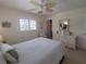 Bright bedroom featuring neutral walls, coastal decor, and carpeted floors at 2220 Broad Ranch Dr, Port Charlotte, FL 33948