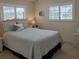 Comfortable bedroom featuring coastal decor, neutral walls, and carpeted floors at 2220 Broad Ranch Dr, Port Charlotte, FL 33948