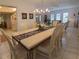 Formal dining room with ornate table and chairs, and tile flooring at 2220 Broad Ranch Dr, Port Charlotte, FL 33948