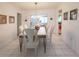 Formal dining room featuring a stylish table set and tile flooring at 2220 Broad Ranch Dr, Port Charlotte, FL 33948