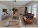 Living room with tiled floors and bright windows with shutters provides ample light at 2220 Broad Ranch Dr, Port Charlotte, FL 33948