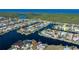 A scenic aerial view shows the home's prime waterfront location within a network of canals at 245 Lido Dr, Punta Gorda, FL 33950