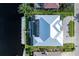 Aerial view of the home showing the layout, landscaping, metal roof, and waterfront access at 245 Lido Dr, Punta Gorda, FL 33950