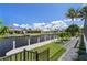 A serene view of the canal from the backyard, offering waterfront living and lush landscaping at 245 Lido Dr, Punta Gorda, FL 33950