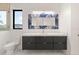 Modern bathroom with a large mirror and dual sinks and cabinets at 245 Lido Dr, Punta Gorda, FL 33950