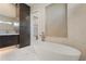Elegant bathroom featuring a modern soaking tub, dual sink vanity, and sophisticated tile details at 245 Lido Dr, Punta Gorda, FL 33950