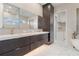 Bathroom featuring double vanity, dark wood cabinets, and modern fixtures at 245 Lido Dr, Punta Gorda, FL 33950