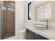 Bathroom with mosaic tile accents, glass enclosed shower, and bowl sink at 245 Lido Dr, Punta Gorda, FL 33950