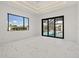 Bedroom with modern ceiling and large window overlooking the pool at 245 Lido Dr, Punta Gorda, FL 33950