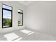 A bright bedroom with two large windows providing natural light and a clean, modern design at 245 Lido Dr, Punta Gorda, FL 33950