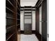 Spacious walk-in closet with custom shelving and drawer units for ample storage at 245 Lido Dr, Punta Gorda, FL 33950
