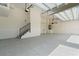 Spacious garage features a sink, stairs to the upper level, and an epoxy floor at 245 Lido Dr, Punta Gorda, FL 33950