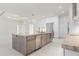Kitchen view featuring island with counter seating, stainless steel appliances, and abundant natural light at 245 Lido Dr, Punta Gorda, FL 33950