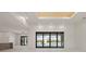 Spacious living area with sliding doors opening to the pool, filled with natural light at 245 Lido Dr, Punta Gorda, FL 33950