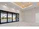 Bright living room with large sliding glass doors leading to the pool area and beautiful marble flooring at 245 Lido Dr, Punta Gorda, FL 33950