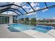 Tanning ledge in sparkling, screened-in pool overlooks the canal at 245 Lido Dr, Punta Gorda, FL 33950
