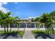 Lovely waterfront view, showcasing a home at the end of the canal with palm trees at 245 Lido Dr, Punta Gorda, FL 33950